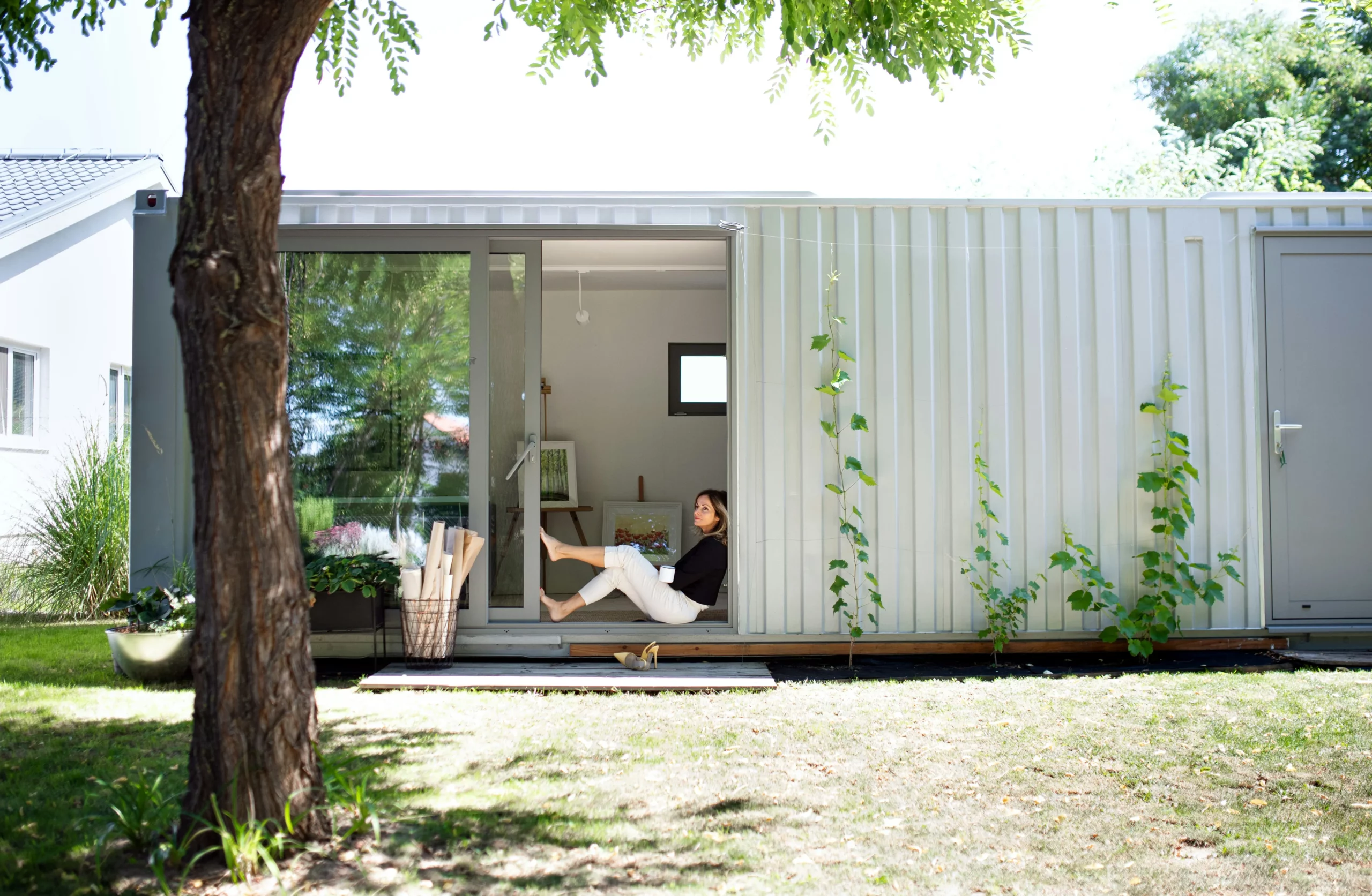 woman sitting in office container